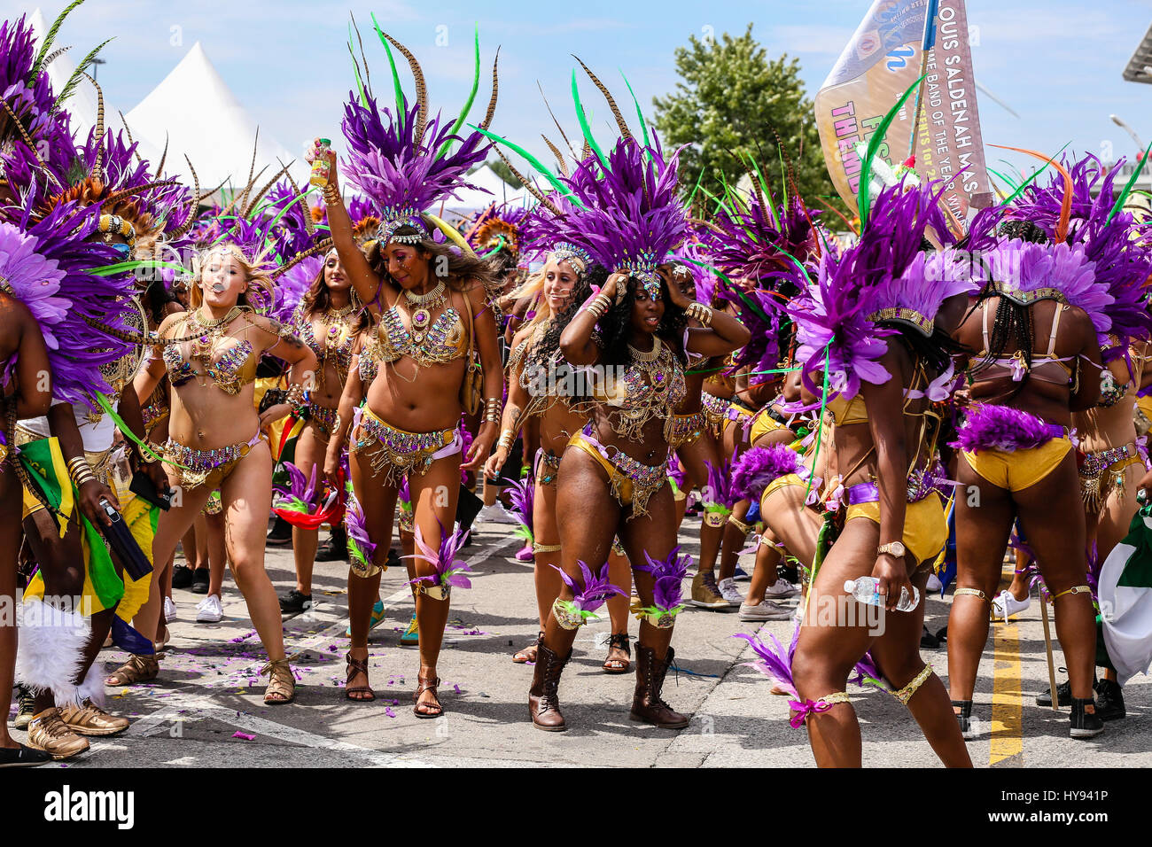 TORONTO, CANADA - JULY 20, 2016: Marchers in costume at The Toronto Caribbean Carnival, formerly called Caribana, a festival of Caribbean Stock Photo