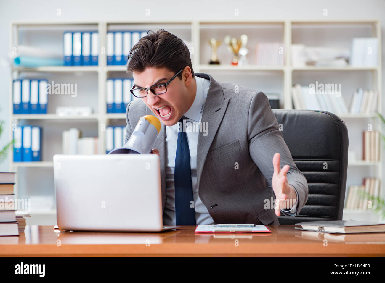 Angry aggressive businessman in the office Stock Photo - Alamy
