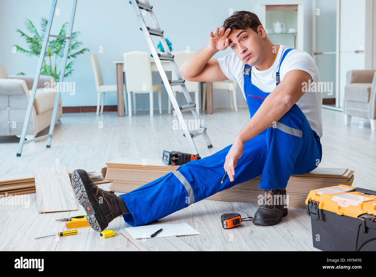 Repairman Laying Laminate Flooring At Home Stock Photo - Alamy