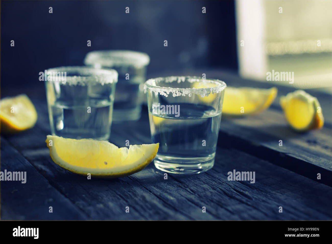 white tequila salt lemon wooden color Stock Photo - Alamy