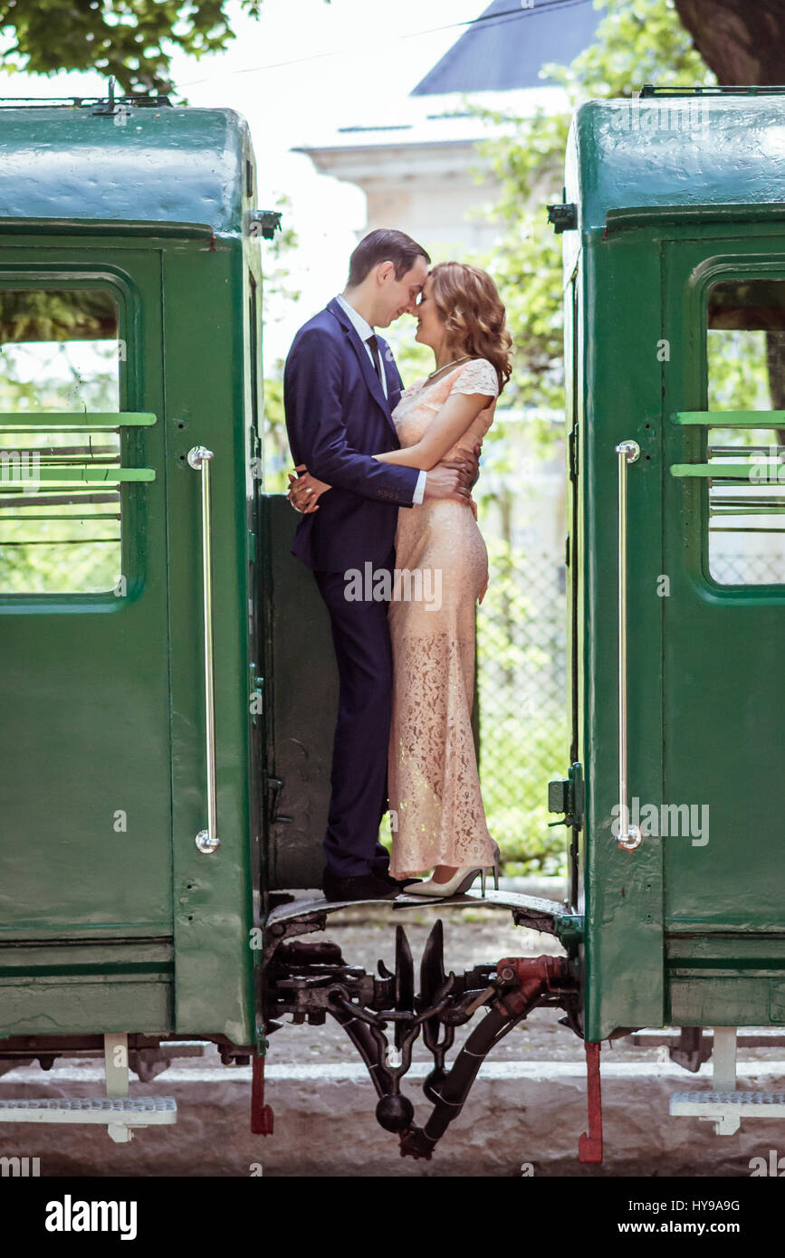 A couple between by wagons Stock Photo