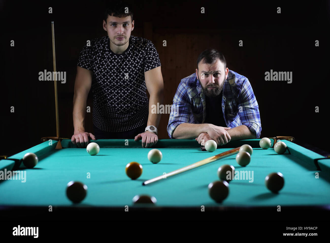 hansome man playing billiards alone Stock Photo Alamy