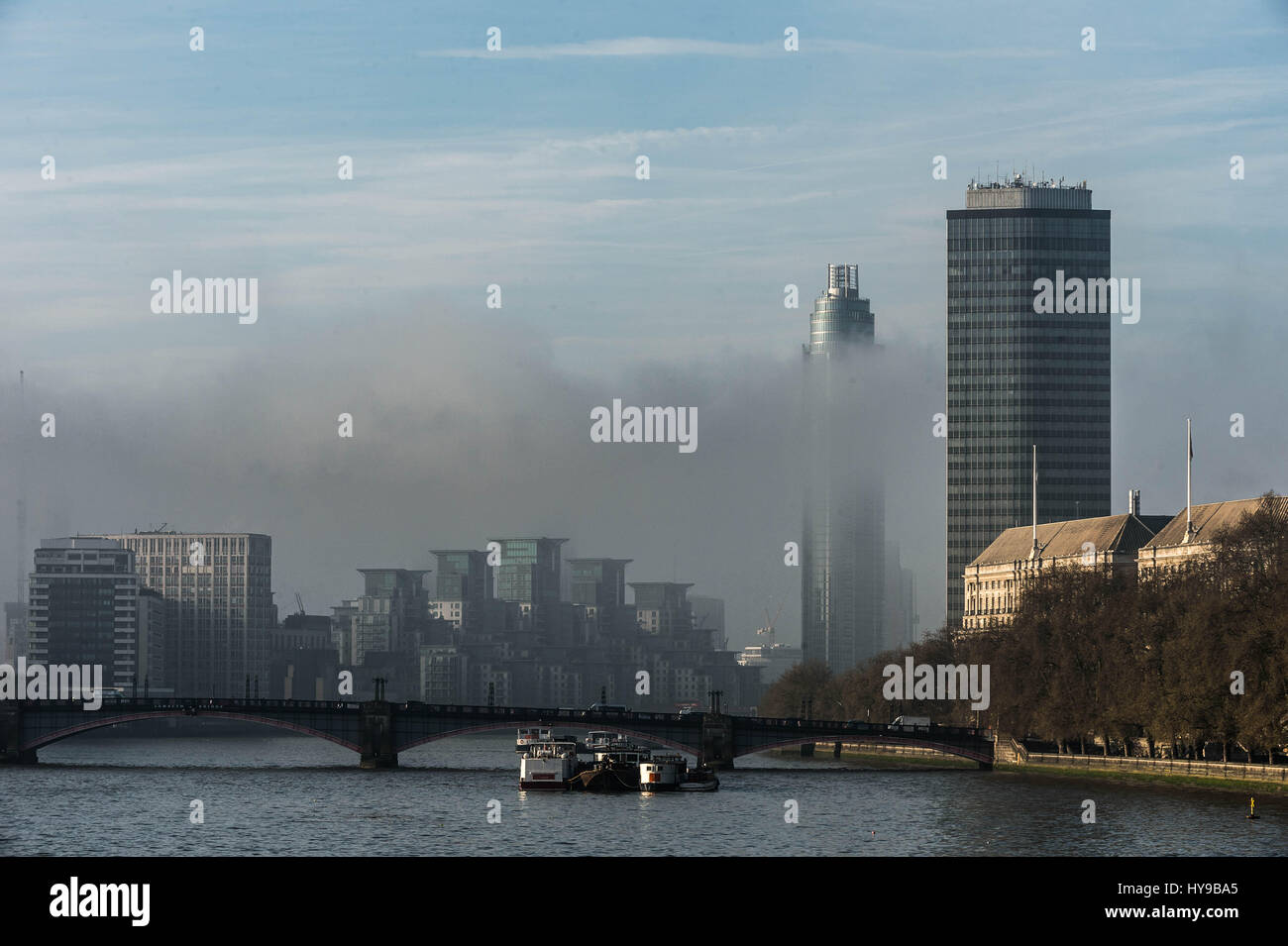 UK Weather: A dense layer of morning smog hangs over central London skyline. Buildings (R-L) Millbank Tower and Broadway Malyan Tower. Stock Photo