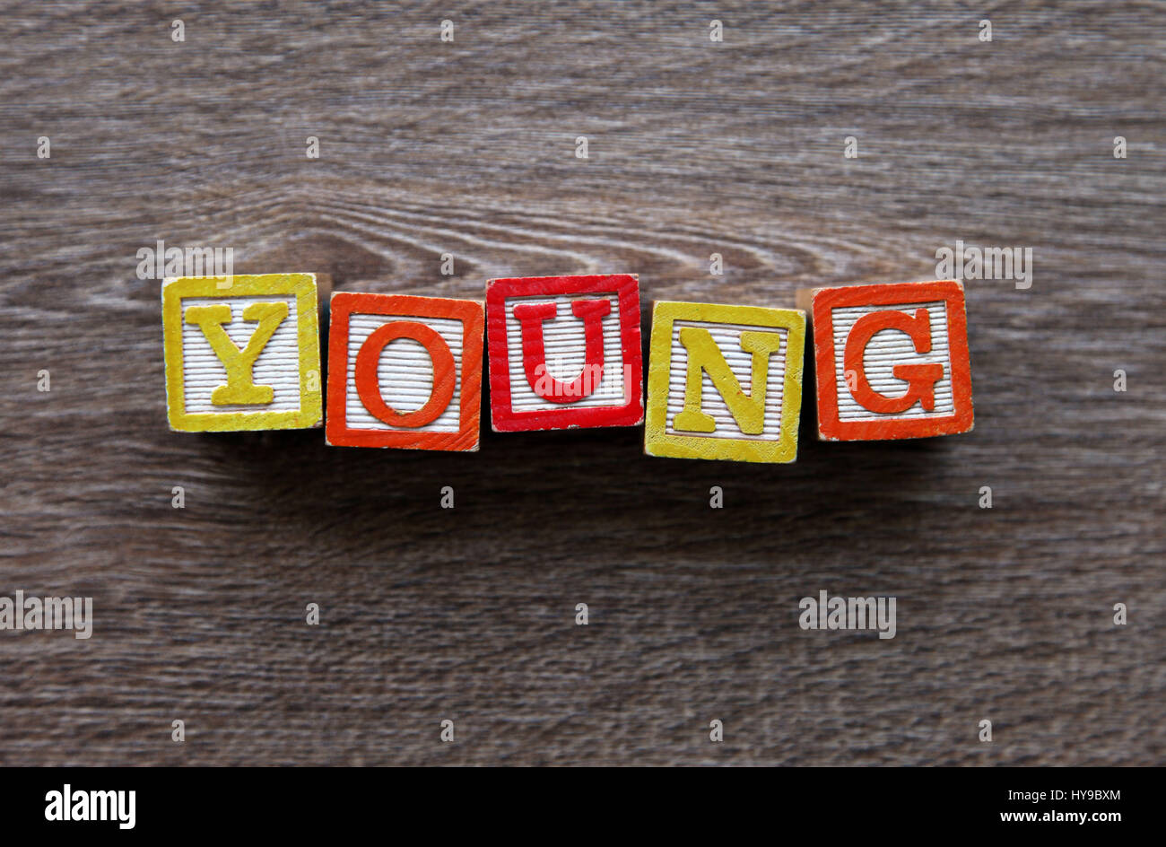 Wood Block letters forming the word YOUNG Stock Photo Alamy