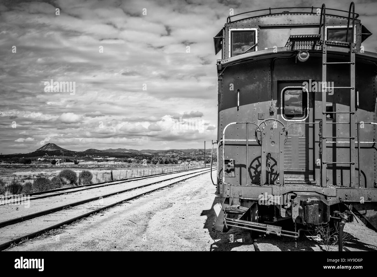 The back of a caboose sitting on a southern California railway. Stock Photo