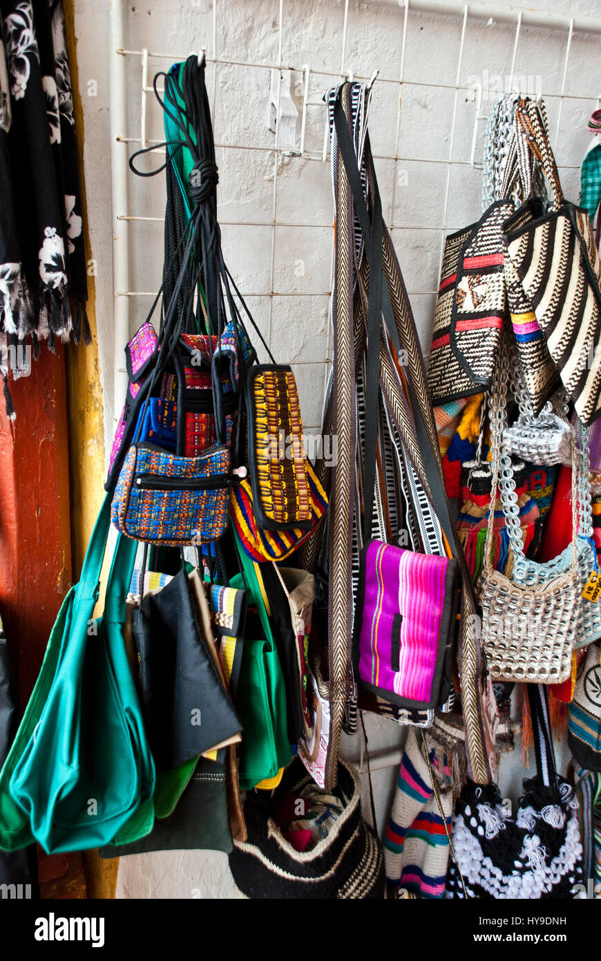 Women fashion accessories, Various items of crocheted bucket-style handbags, Wayuu handcrafted mochilas woolen bags, Colombia - street market Stock Photo