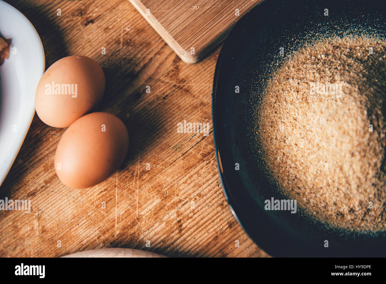 Eggs and breadcrumbs on the table Stock Photo Alamy