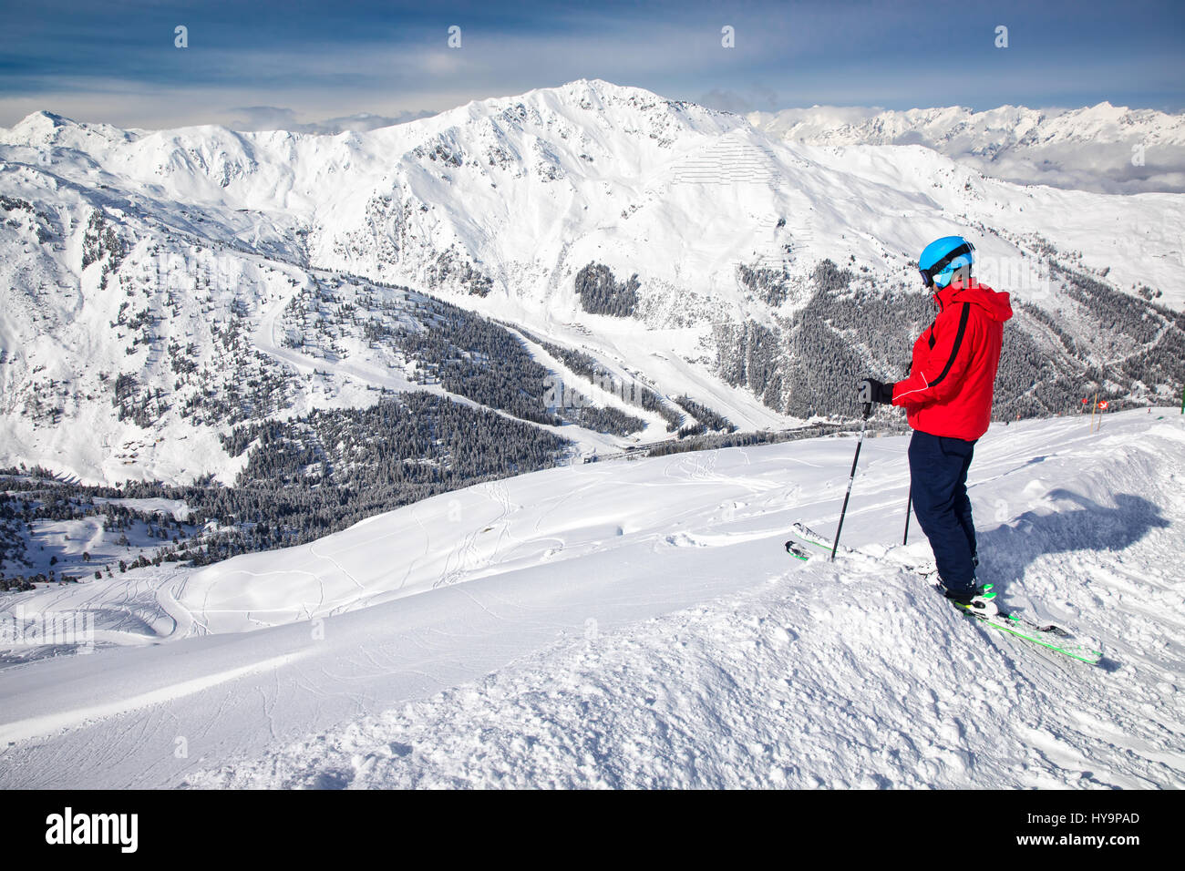 Man enjoying the stunning view before freeride skiing in famous ski resort in Tyrolian Alps, Zillertal, Austria Stock Photo