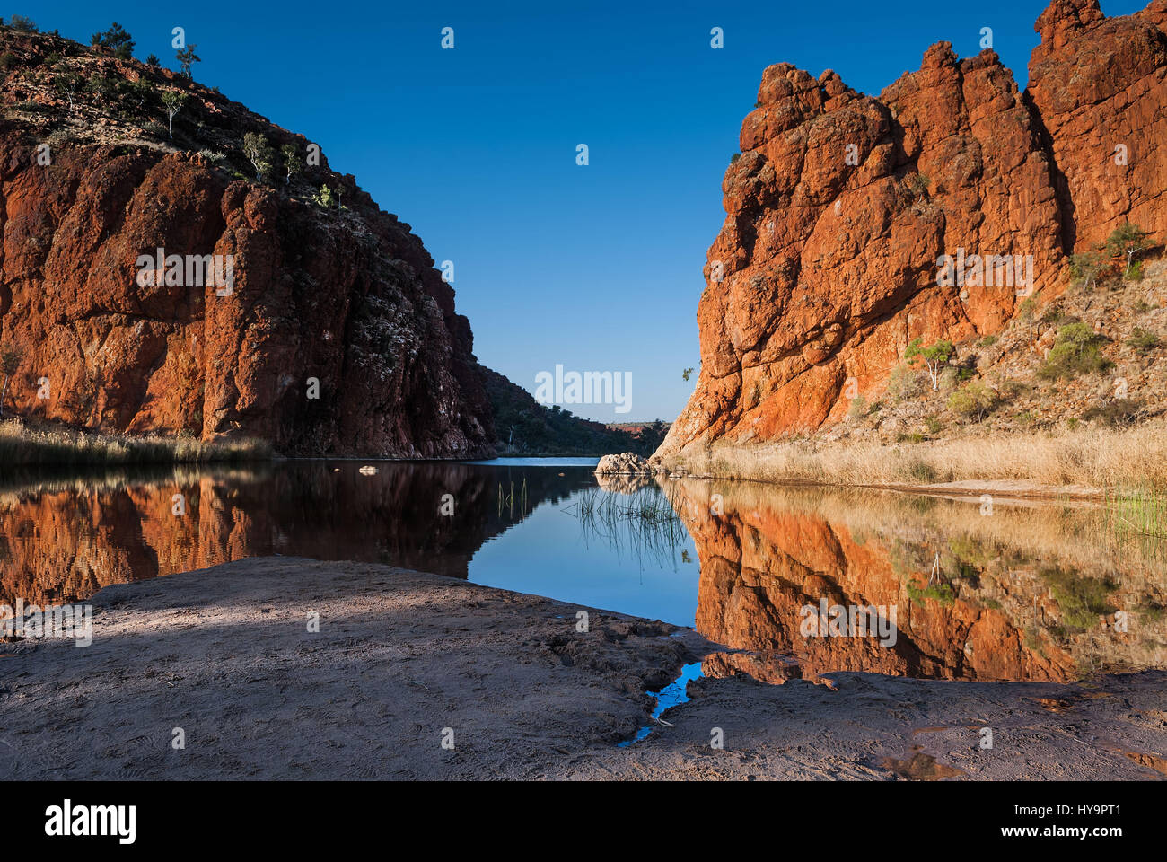 Reflections of rock formations at Glen Helen Gorge water hole in Northern Territory Central Australia Stock Photo