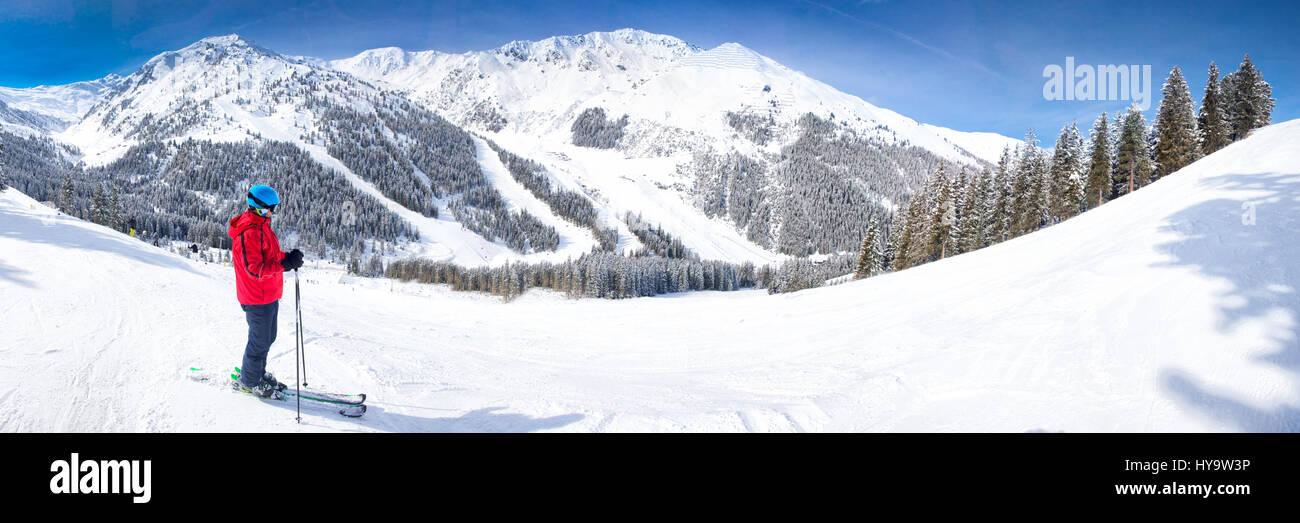 Man enjoying the stunning view before skiing in famous ski resort in Tyrolian Alps, Zillertal, Austria Stock Photo