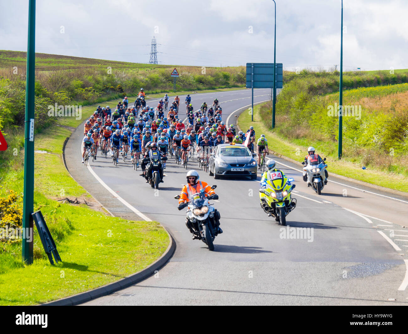 Cleveland England UK April 2nd 2017: The Cleveland Klondike Grad Prix cycle race for professional riders took place today. With start and finish in Guisborough Cleveland the 92 mile 149km race took place over four laps of a circuit through the East Cleveland villages, coast and countryside. 140 riders took part and the race was won by Chris Latham of Team Wiggins (3:59.16), ahead of Enrique Sanz (Raleigh GAC) and third place BIKE Channel Canyon rider Harry Tanfield, a local rider from Great Ayton. Riders descending into Carlin How on the first lap Credit: Peter Jordan NE/Alamy Live News Stock Photo