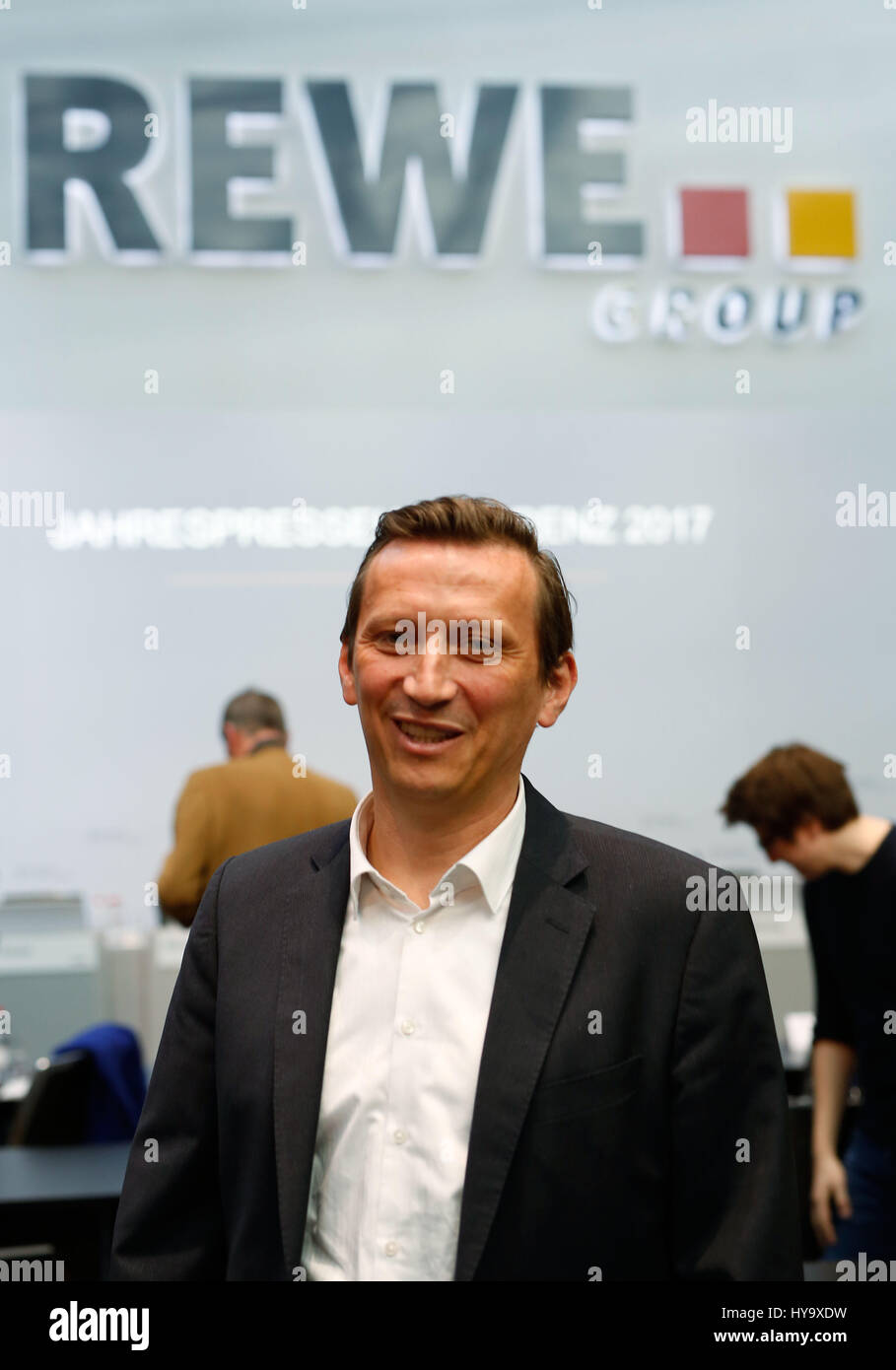 Cologne, Germany. 28th Mar, 2017. The new chairman of the retail chain Rewe, Lionel Souque, photographed in front of a Rewe logo in Cologne, Germany, 28 March 2017. Rewe presented its annual financial results. Photo: Annika Fußwinkle/dpa/Alamy Live News Stock Photo