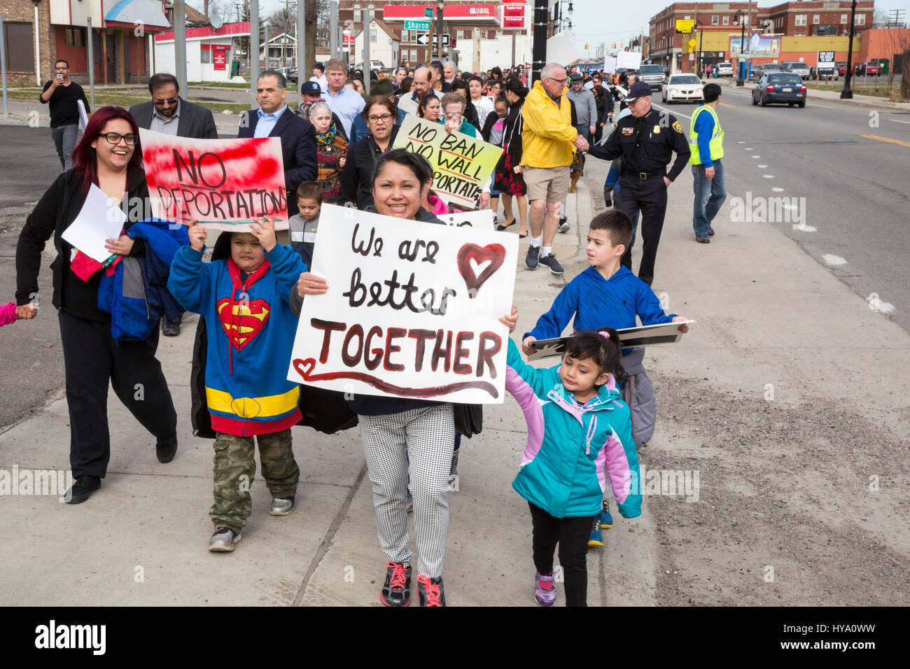 Detroit and Dearborn, Michigan, USA. 2nd Apr, 2017. 'Neighbors Building Bridges': Mexican and Muslim immigrants march from St. Gabriel's Catholic Church to the American Muslim Society's mosque to show unity and to oppose President Trump's plans to build a border wall and to stop Muslim travel to the United States. Credit: Jim West/Alamy Live News Stock Photo