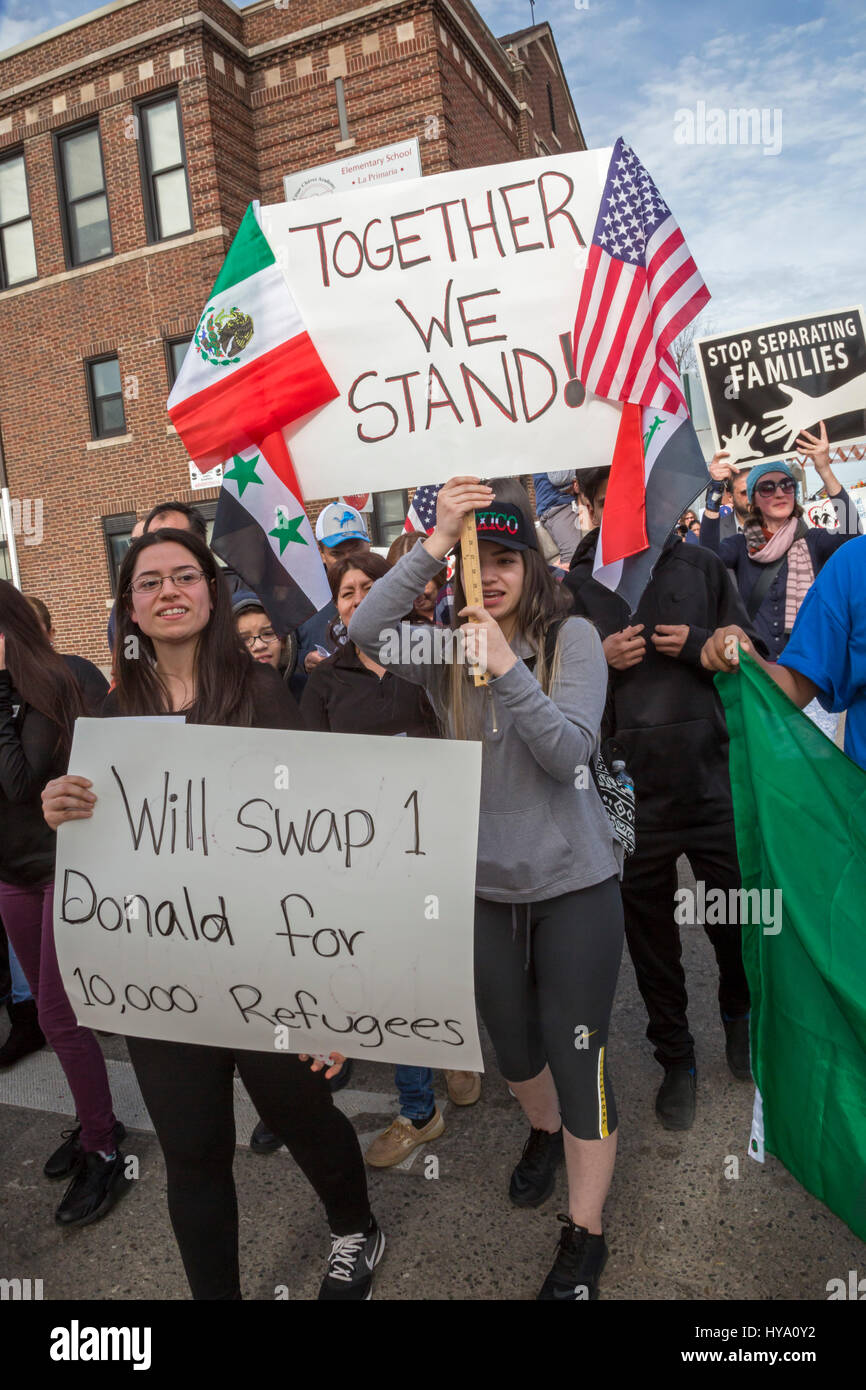 Detroit and Dearborn, Michigan, USA. 2nd Apr, 2017. 'Neighbors Building Bridges': Mexican and Muslim immigrants march from St. Gabriel's Catholic Church to the American Muslim Society's mosque to show unity and to oppose President Trump's plans to build a border wall and to stop Muslim travel to the United States. Credit: Jim West/Alamy Live News Stock Photo