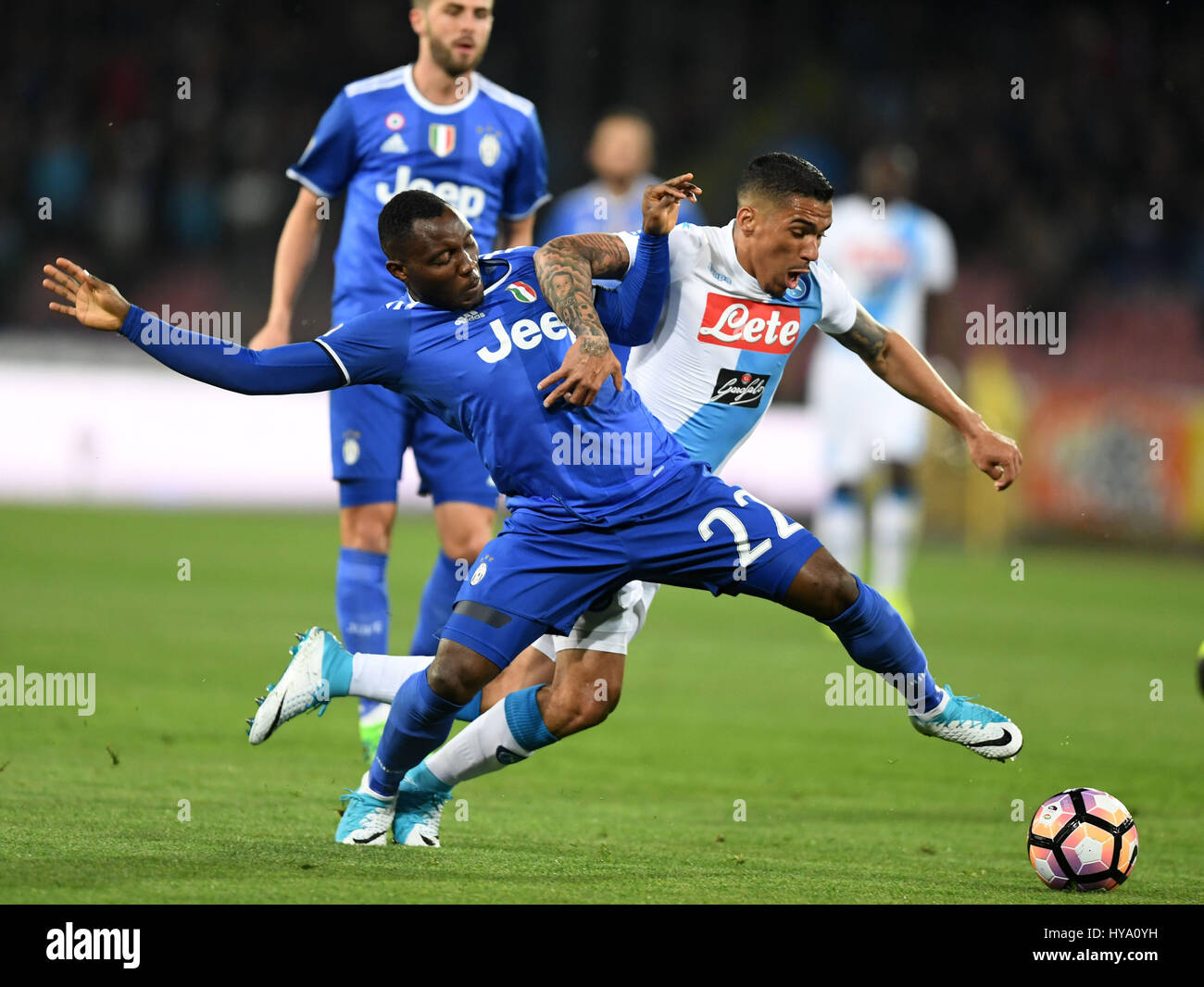 Napoli, Italy. 2nd Apr, 2017. Juventus' Kwadwo Asamoah (L) competes with Napoli's Allan during the Italian Serie A soccer match in Napoli, Italy, April 2, 2017. The game ended with a 1-1 tie. Credit: Alberto Lingria/Xinhua/Alamy Live News Stock Photo