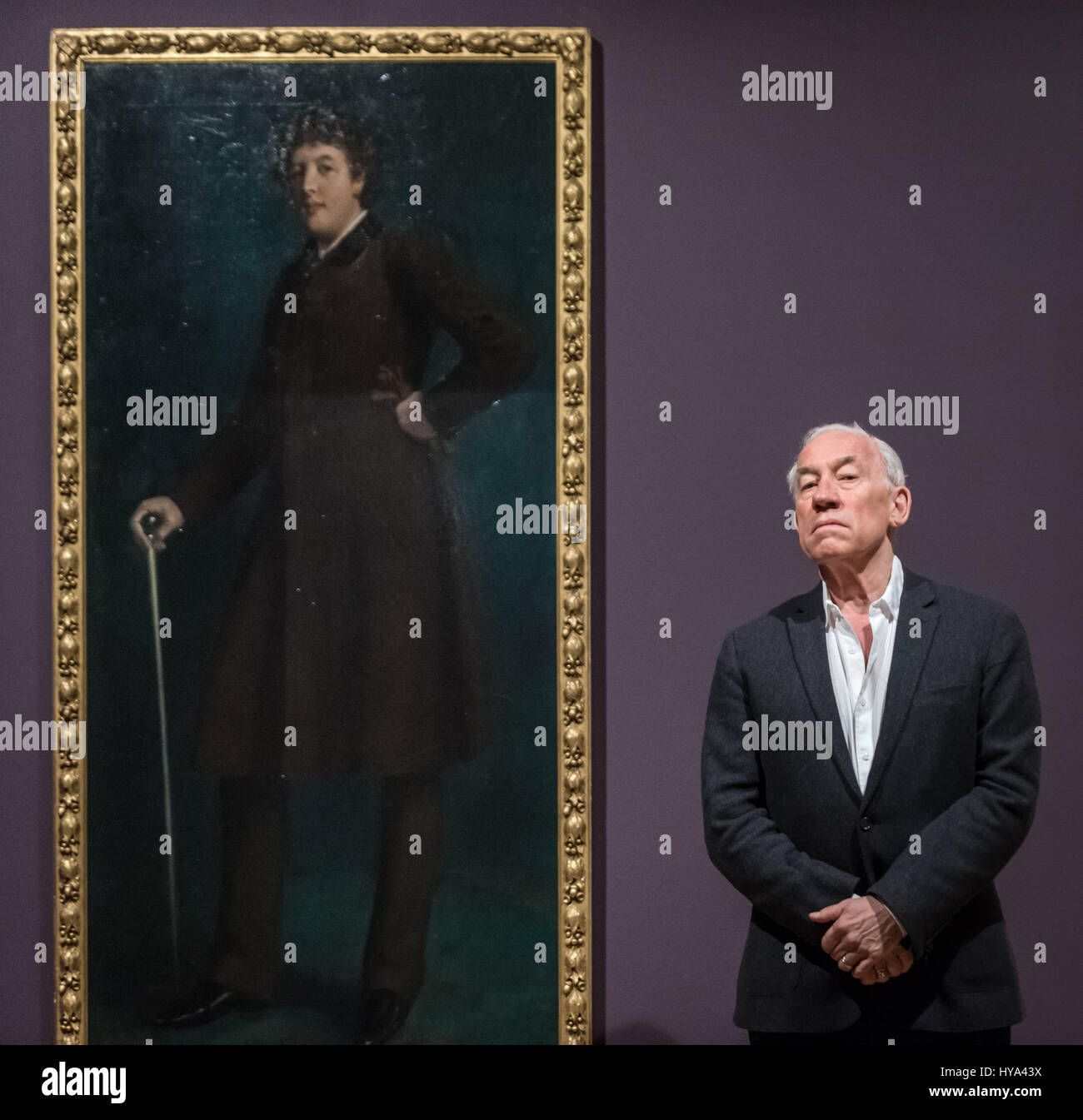 London, UK. 3rd Apr, 2017. Actor Simon Callow poses for photos in front of Oscar Wilde portrait painting by US artist Robert Goodloe Harper Pennington. Tate Britain opens first ever exhibition dedicated to Queer British art. Queer British Art 1861-1967 marks the 50th anniversary of partial decriminalisation of male homosexuality in England and Wales Credit: Guy Corbishley/Alamy Live News Stock Photo