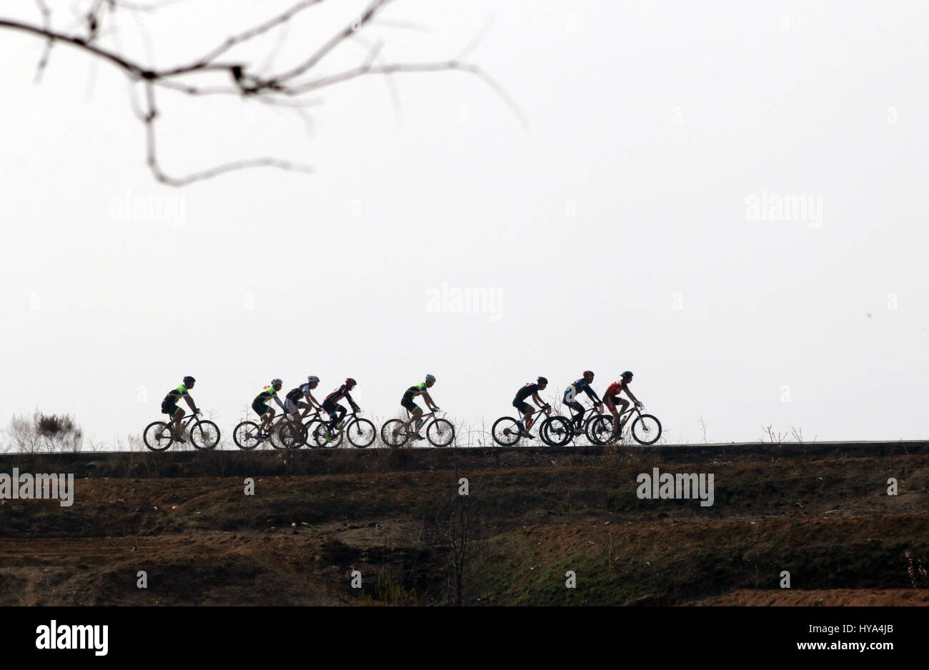 Zoucheng, China's Shandong Province. 2nd Apr, 2017. Cyclists compete in a race game during the Qingming Holiday, the three-day holiday for the Tomb-Sweeping Day, in Zoucheng, east China's Shandong Province, April 2, 2017. Credit: Wang Qisheng/Xinhua/Alamy Live News Stock Photo