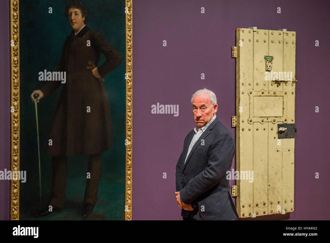 London, UK. 3rd Apr, 2017. Simon Callow with Oscar Wilde by Robert Goodloe Harper Pennington (1881)and the door of Oscar Wilde's prison cell (no. C.3.3) at Reading jail - Queer British Art 1861-1967 a new exhibition at Tate Britain marks the 50th anniversary of partial decriminalisation of male homosexuality in England and Wales. Spanning the playful to the political, the explicit to the domestic, Queer British Art 1861-1967 showcases the rich diversity of queer visual art and its role in society. Credit: Guy Bell/Alamy Live News Stock Photo