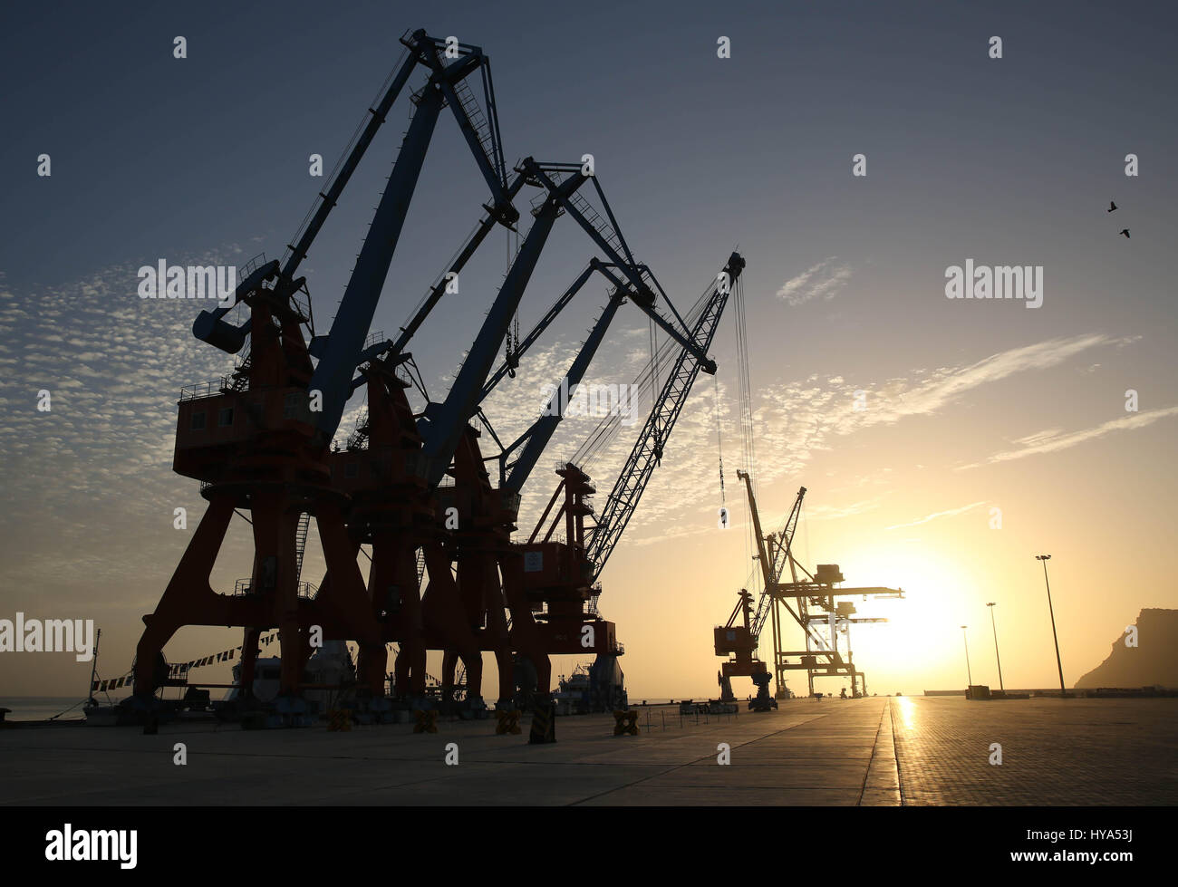(170403) -- GWADAR(PAKISTAN), April 3, 2017 (Xinhua) -- Photo taken on March 23, 2017 shows the Gwadar port area at sunrise in Gwadar, Pakistan. Gwadar, a poorly-known port town previously in Pakistan has been becoming a new economic engine for the country with the construction of a free zone co-built with China. (Xinhua/Liu Tian) (sxk) Stock Photo