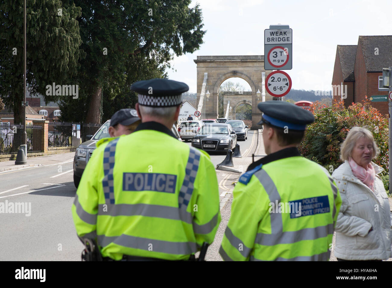 Marlow, Buckinghamshire, UK. 2nd Apr, 2017. Thames vally police enforce the weight limit on the week bridge in Marlow Buck police officer watching the traffic across the bridge Credit: Brian Southam/Alamy Live News Stock Photo