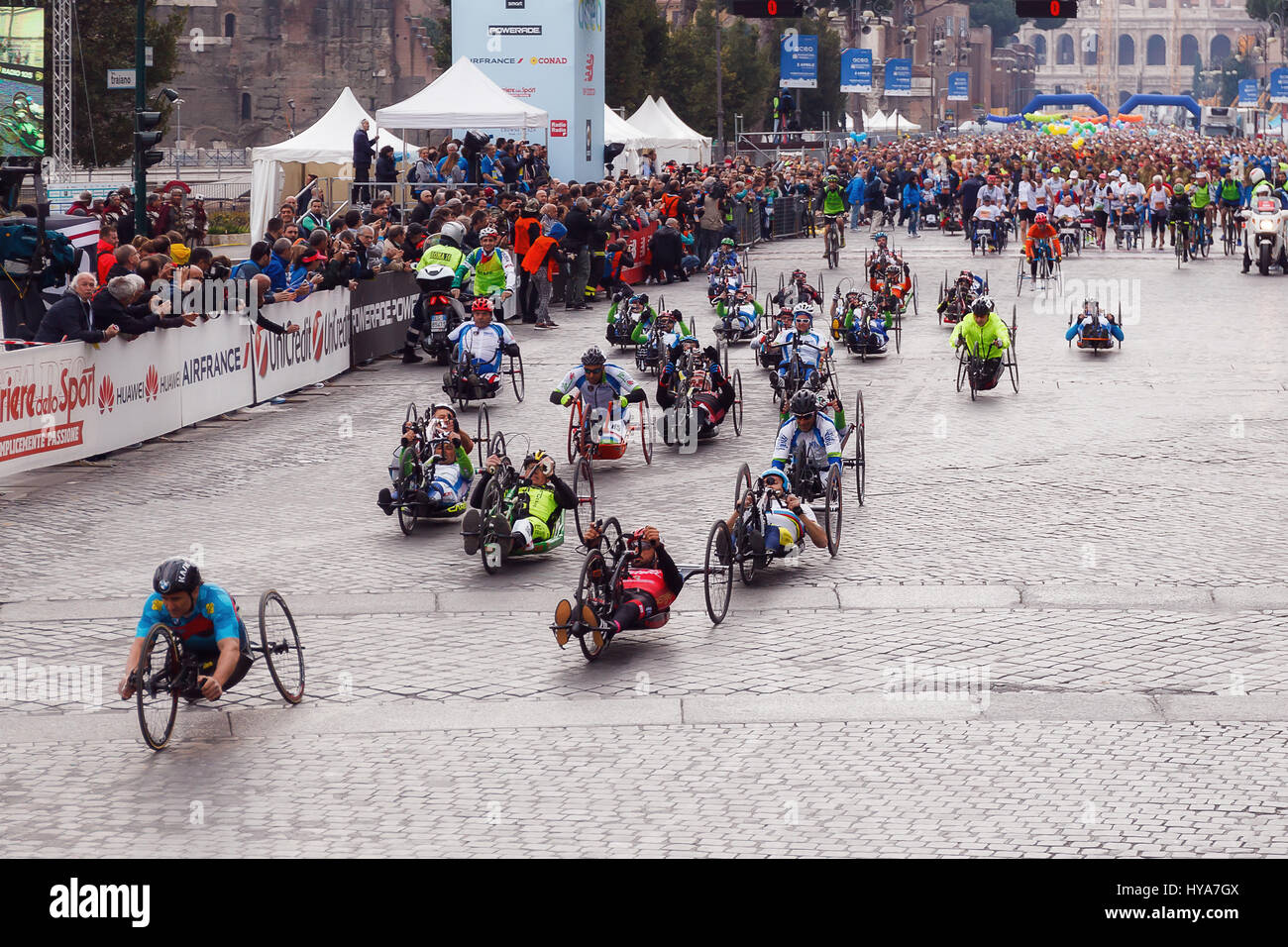 Rome, Italy. 02nd Apr, 2017. Rome, Italy - April 2, 2017: hand cycle, the departure of the athletes on Via dei Fori Imperiali, the Coliseum on background. Credit: Polifoto/Alamy Live News Stock Photo