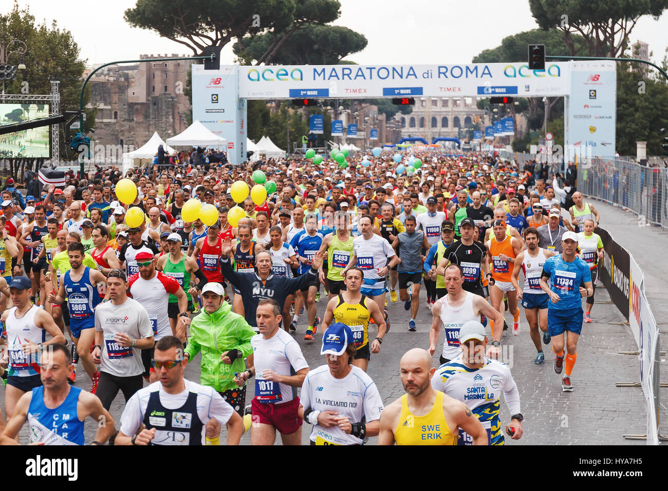 Rome, Italy. 02nd Apr, 2017. Rome, Italy - April 2, 2017: the departure of the athletes on Via dei Fori Imperiali, the Coliseum on background. Credit: Polifoto/Alamy Live News Stock Photo