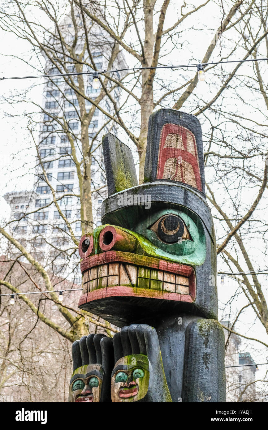 Northwest native American totem pole in Seattle.  Close up vertical images and no people Stock Photo