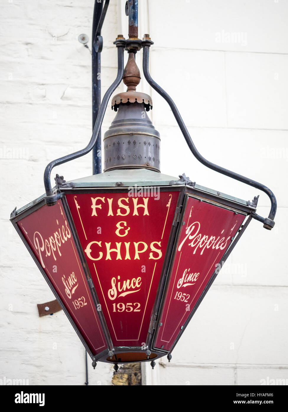 Fish & Chip Shop Sign - Old fashioned hanging sign outside Poppies fish and chips shop near Spitalfields Market in London's East End Stock Photo