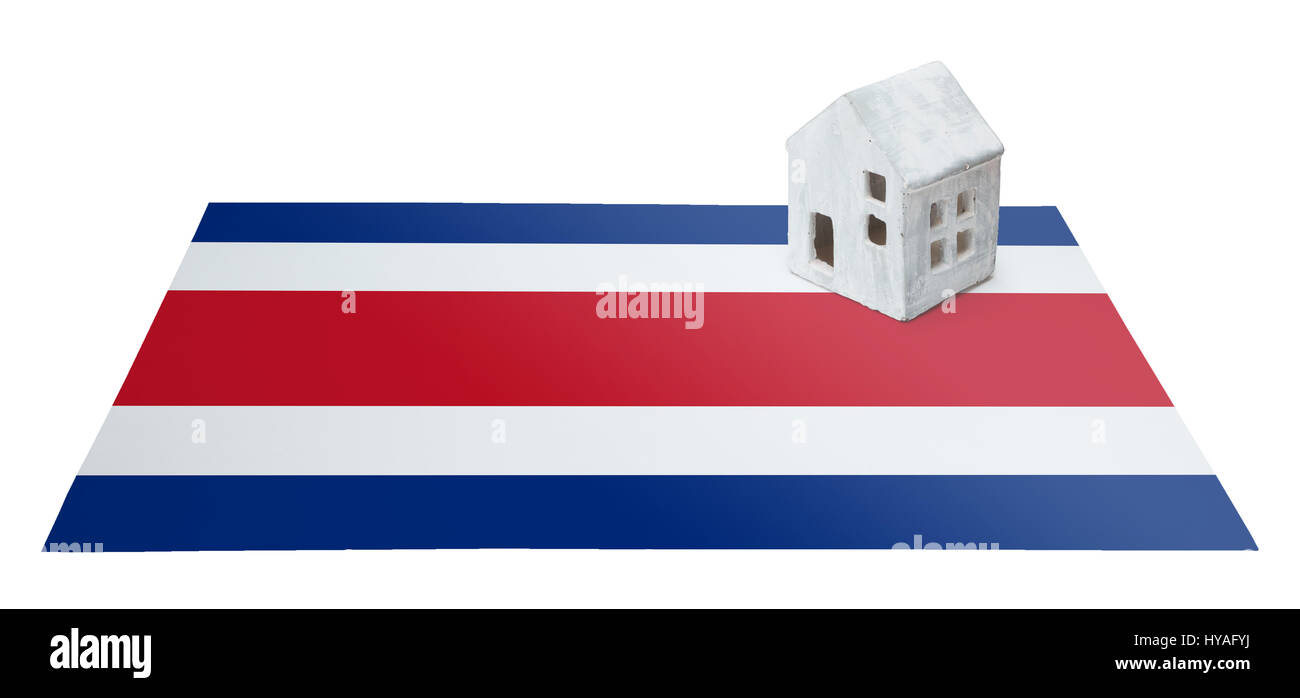 Small house on a flag - Living or migrating to Costa Rica Stock Photo