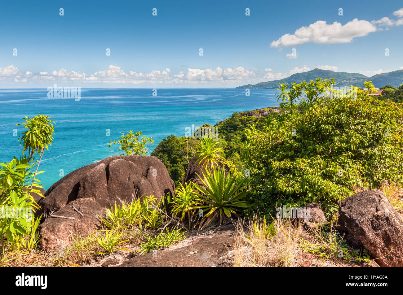 View from Anse Major Trail over the northwest coastline of Mahe island and granite rock in the foreground Stock Photo