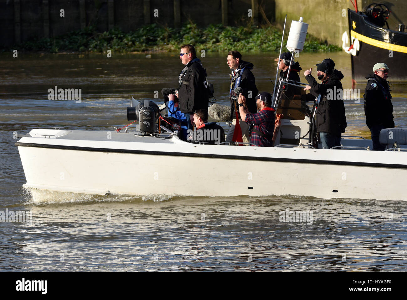 University Boat Race on the River Thames at Barnes, London. Chase boat with umpire Matthew Pincent Stock Photo