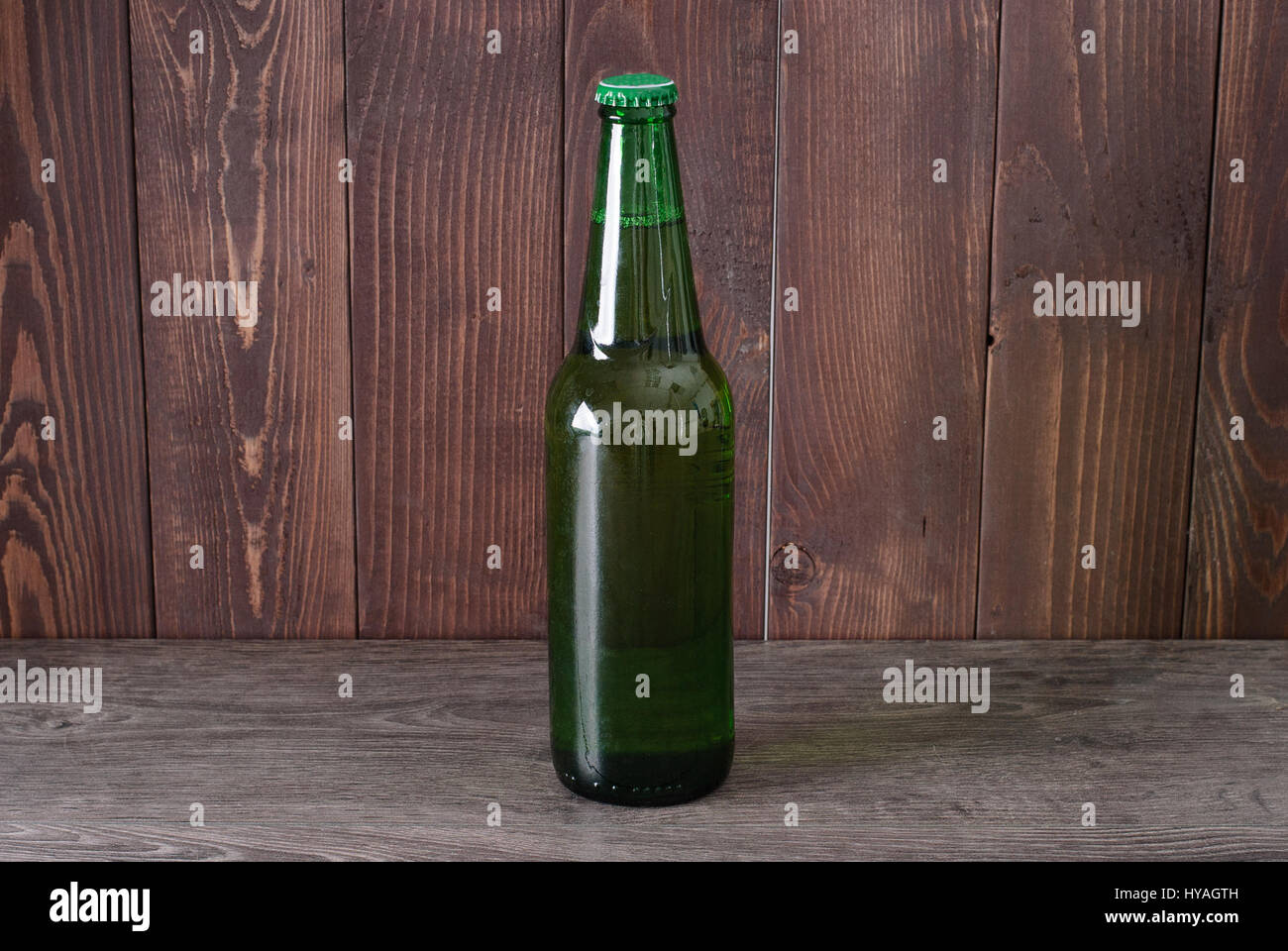 bottle of beer on a wooden background Stock Photo