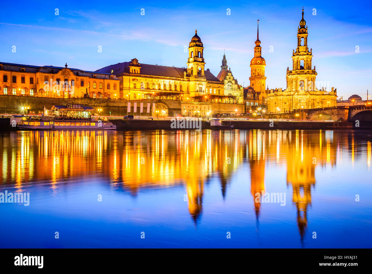 Dresden, Germany. Cathedral of the Holy Trinity or Hofkirche, Bruehl's Terrace. Twilight sunset on Elbe river in Saxony. Stock Photo