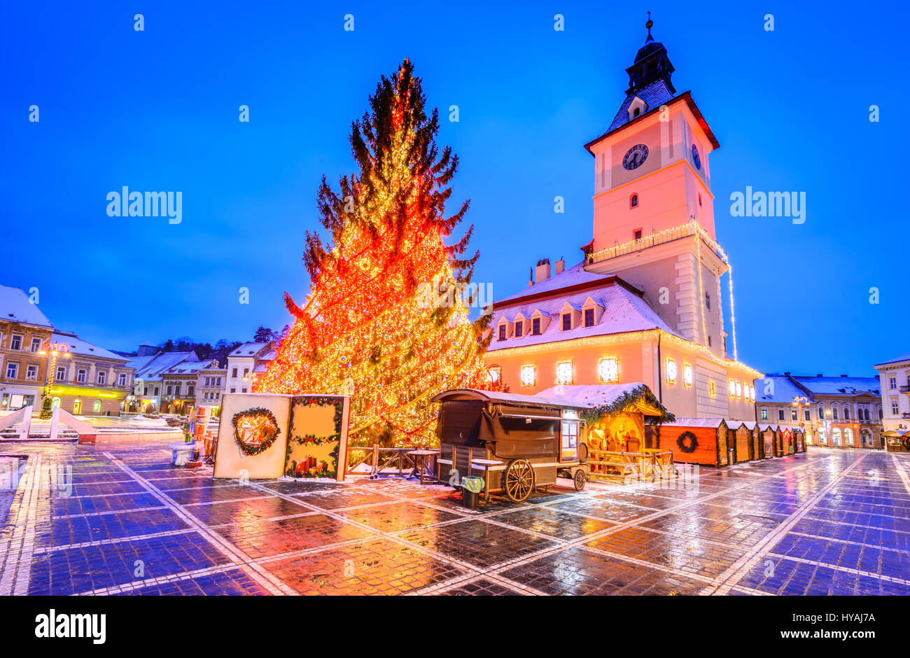 Brasov, Romania. Christmas Market in Main Square, with Xmas Tree and lights. Transylvania landmark. Stock Photo