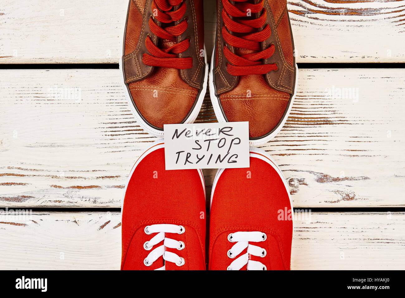 Men's gumshoes on wooden surface Stock Photo Alamy
