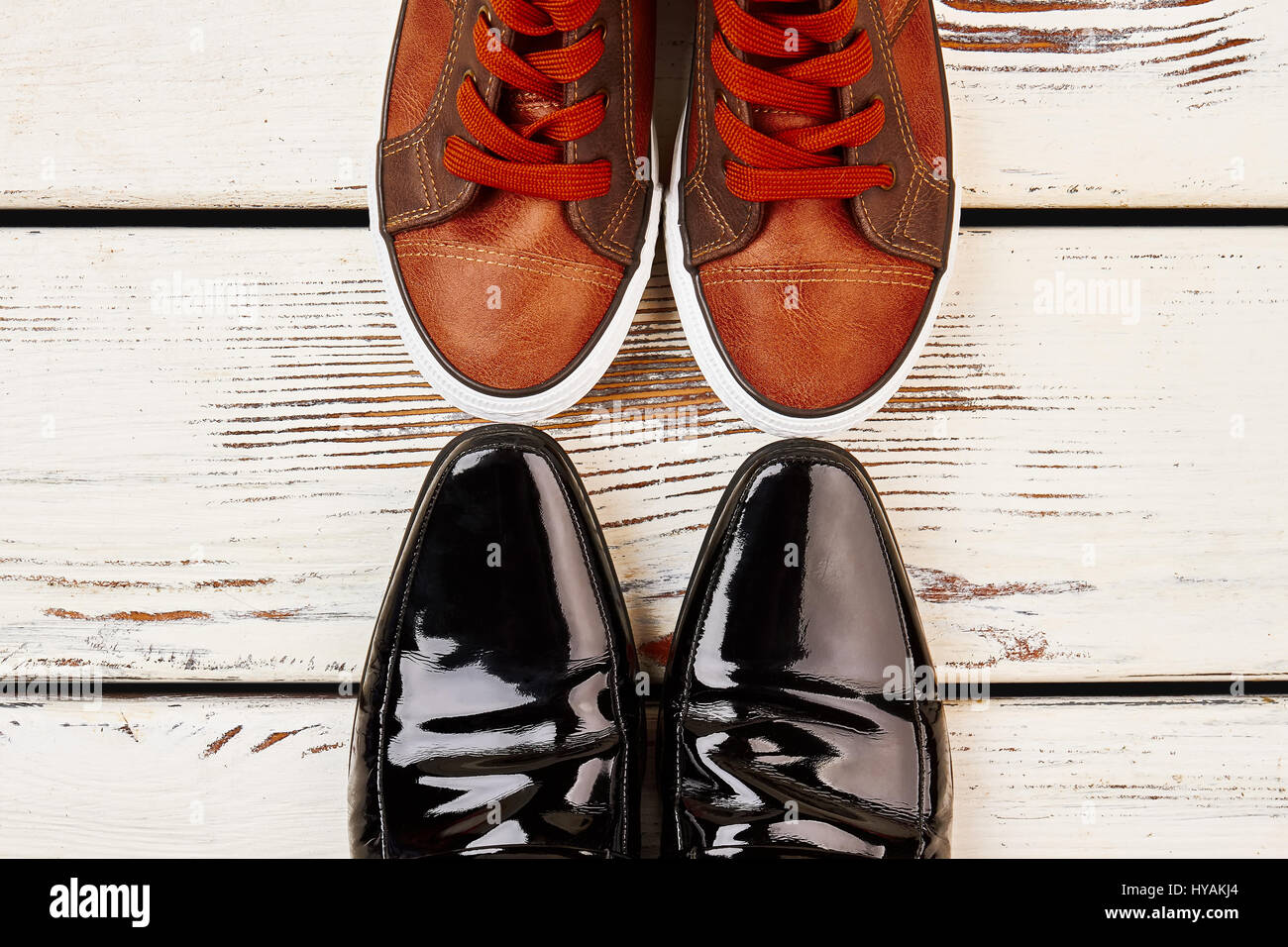 Patent-leather shoes and keds. Stock Photo