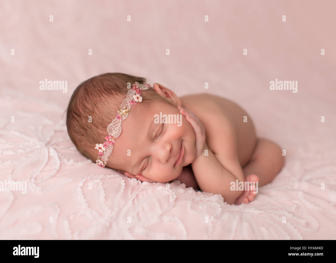 LONDON, UK: HAPPY British babies could not get any cuter. Pictures show how as we move into springtime newborn babies as young as just ten days old respond with smiles and giggles to melt the hardest of hearts. In another picture an adoring mother cannot resist giving her little angel a loving squeeze. London baby photographer Sandi Ford released the pictures to celebrate Mother’s Day and the coming of Spring. Stock Photo