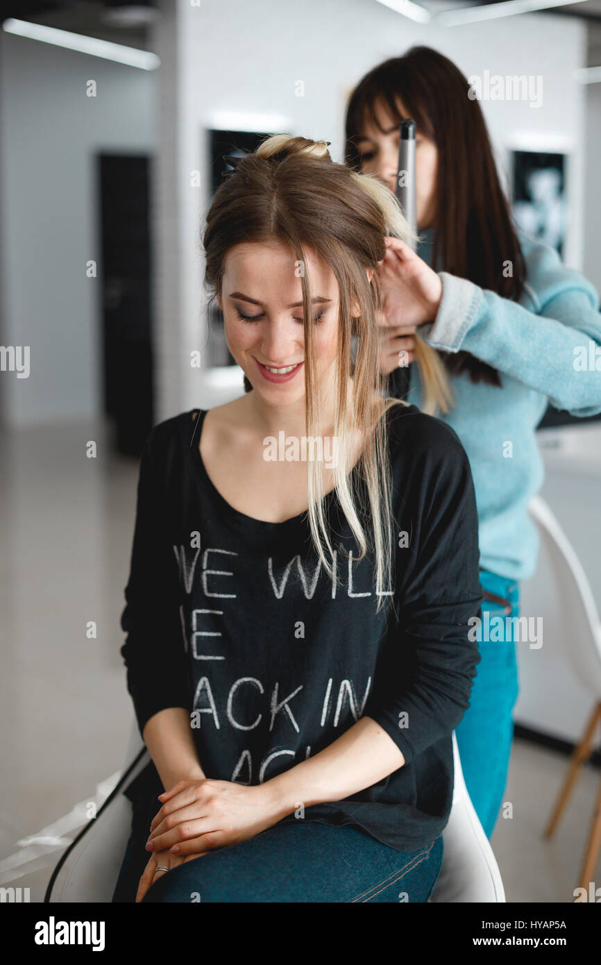 Kyiv, Ukraine March 3, 2017 The hairdresser does the styling for the