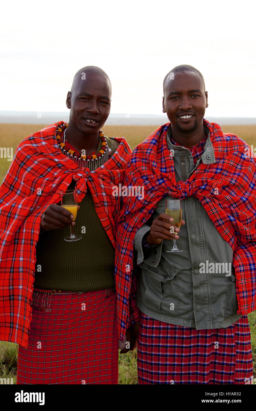 Maasai Warrior Guides enjoy celebrate a hot air balloon ride  in the Maasai Mara. Stock Photo