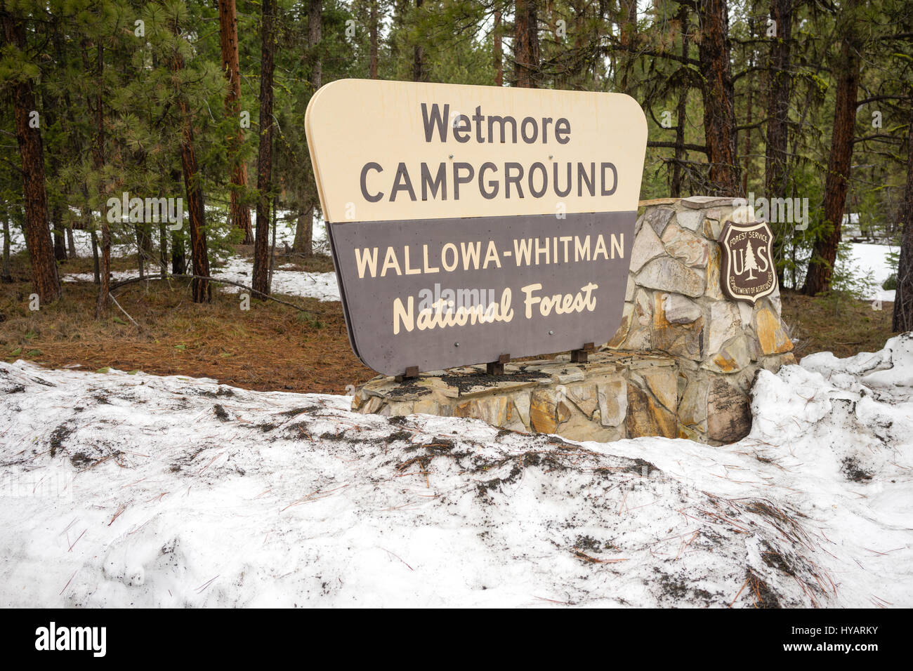 Fresh snow stands around the Wetmore Campground sign in Wallowa-Whitman National Forest Stock Photo