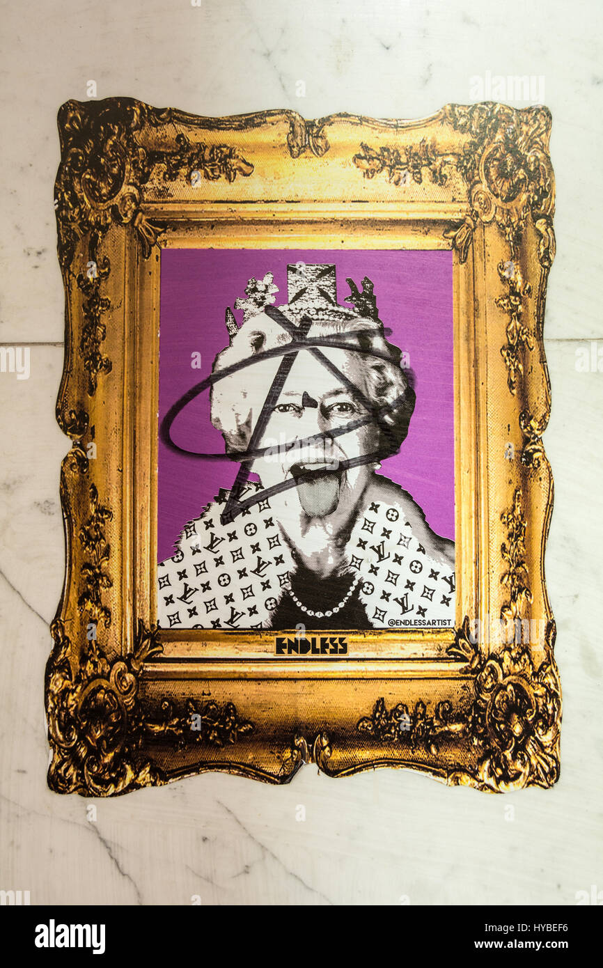 A defaced street art portrait of the Queen of England by Endless in Mayfair, London, UK Stock Photo