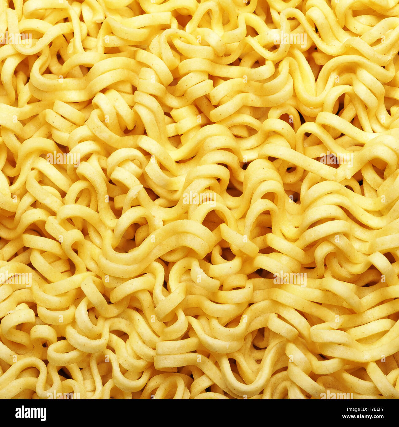 Texture of yellow instant noodles close up Stock Photo - Alamy