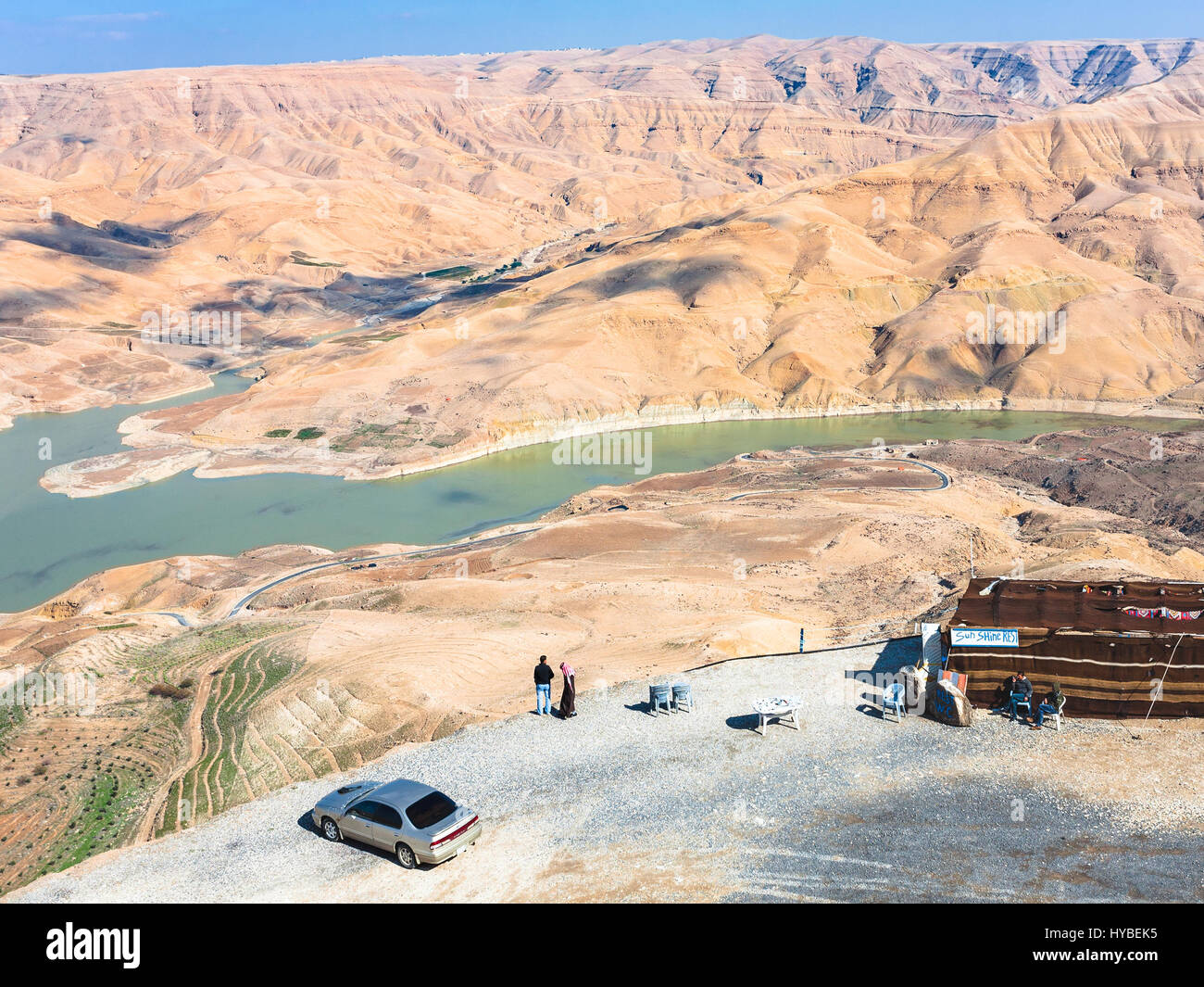 DHIBAN, JORDAN - FEBRUARY 20, 2012: tourists at viewpoint over Al Mujib dam  on Wadi Mujib river on King's highway in winter. King's Road was trade rou  Stock Photo - Alamy