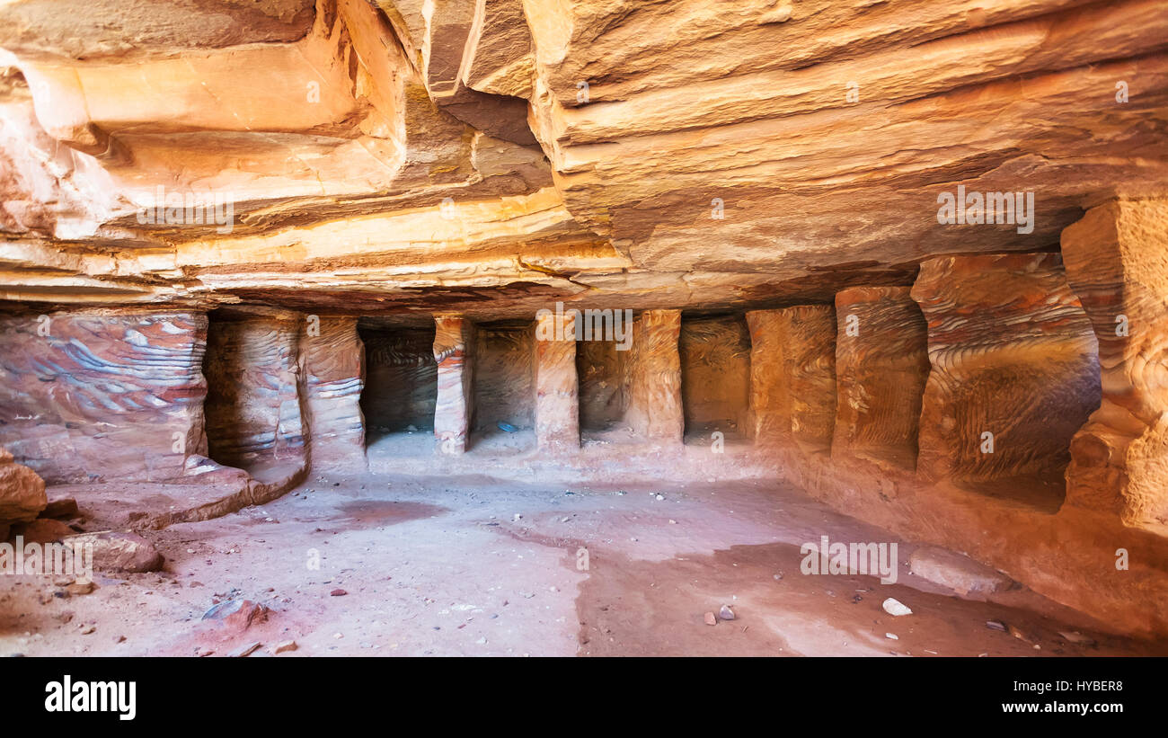PETRA, JORDAN - FEBRUARY 21, 2012: interior of sandstone rock-cut tombs (Kokh) in Petra town. Rock-cut town Petra was established about 312 BC as the  Stock Photo