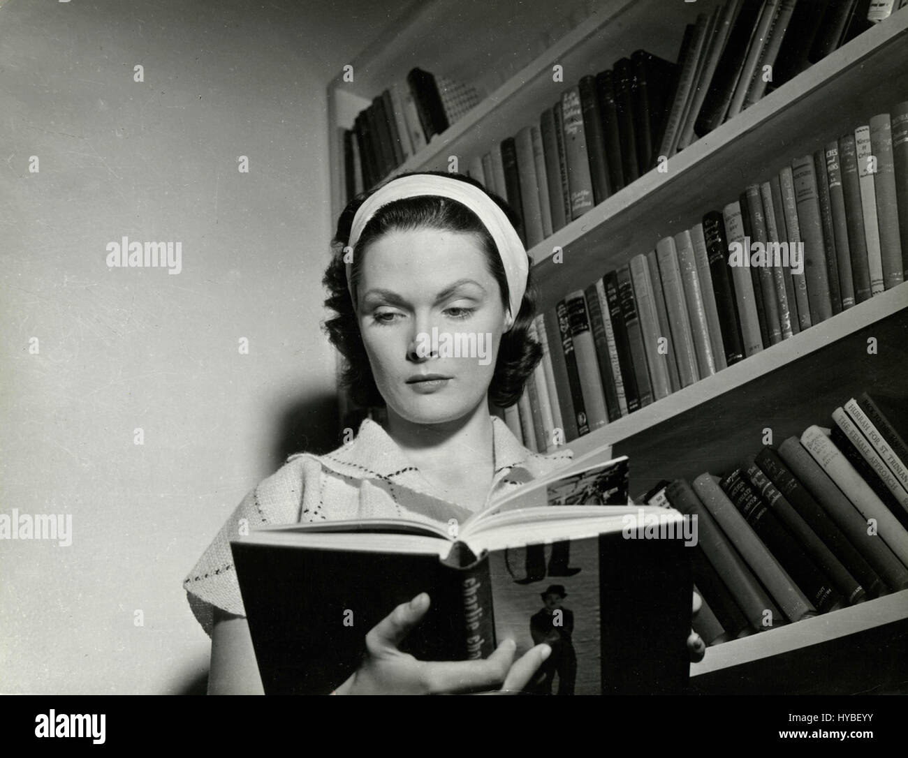 British actress Tamara Lees reading a book, UK Stock Photo