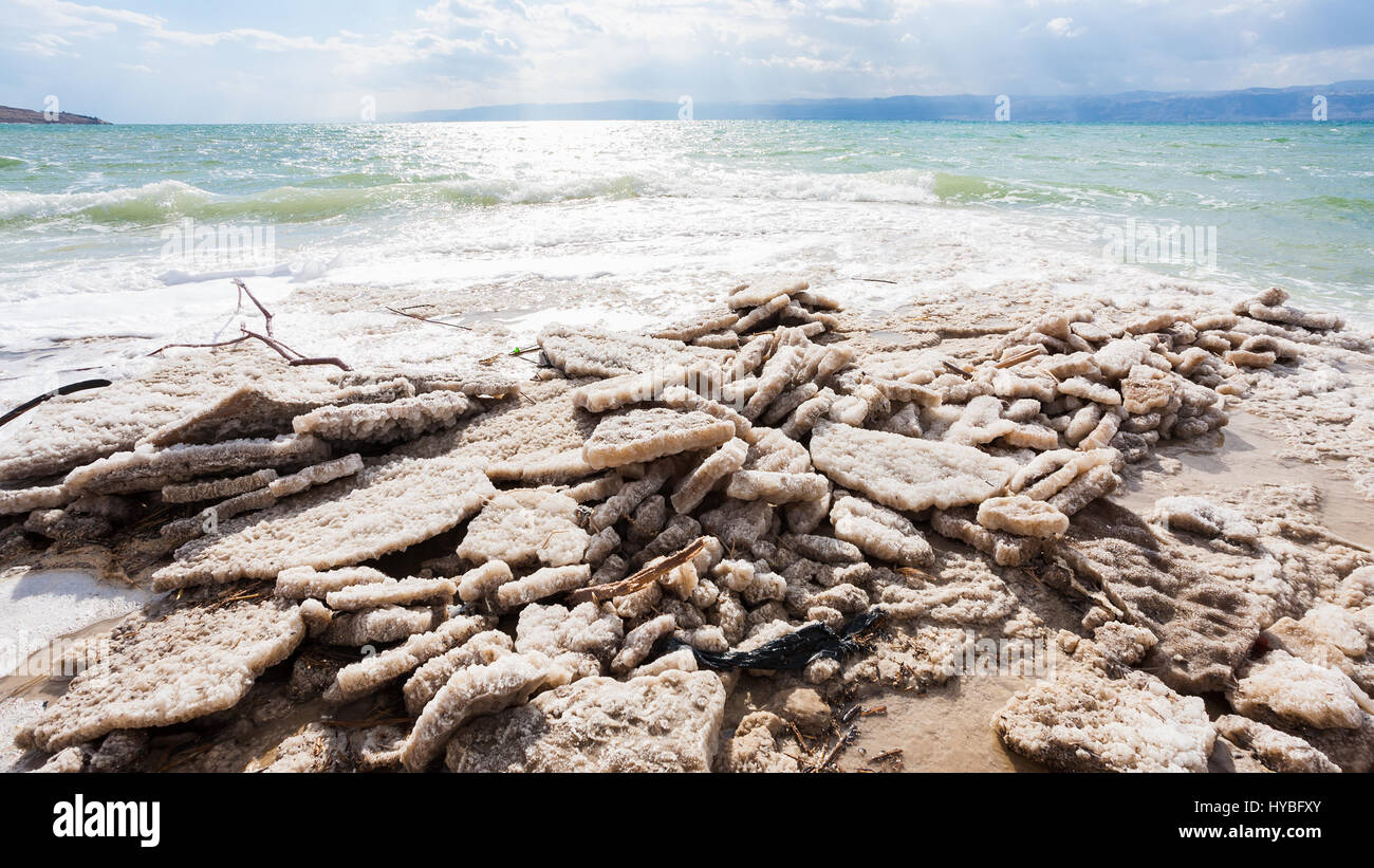 Travel to Middle East country Kingdom of Jordan - natural salt on coastline of Dead Sea in winter Stock Photo