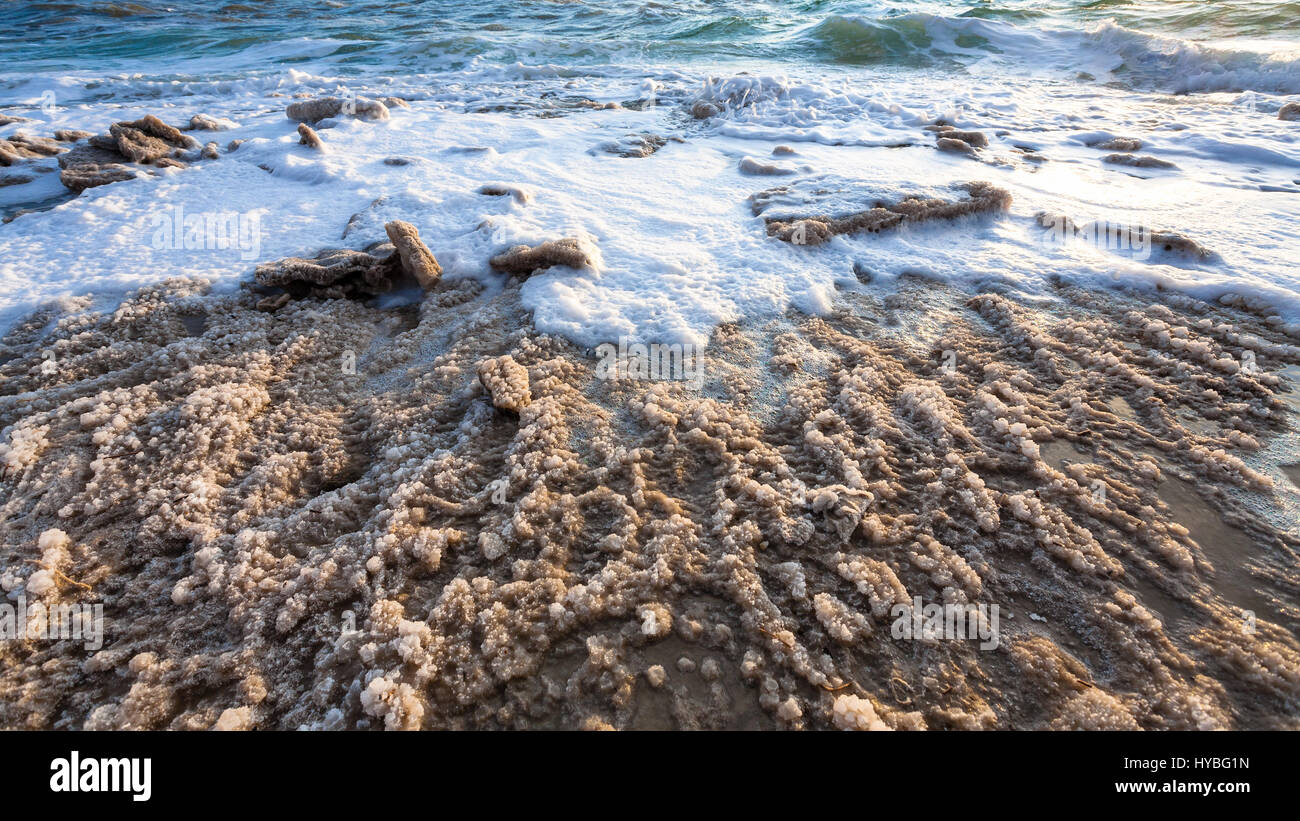 Travel to Middle East country Kingdom of Jordan - crystalline coastline of Dead Sea on winter evening Stock Photo