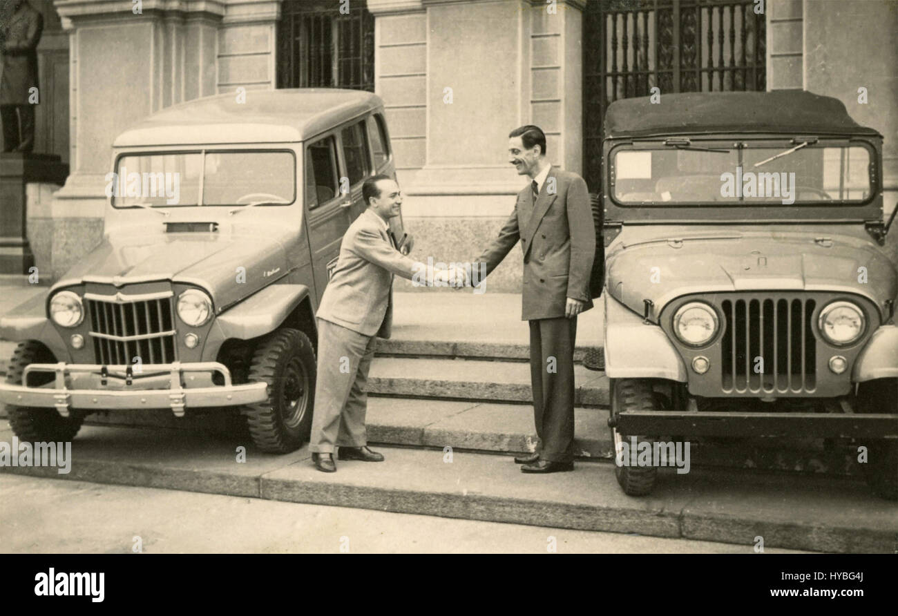 Prof. Solaini, director of Polytechnic University of Milan receives Jeeps car, Italy 1955 Stock Photo