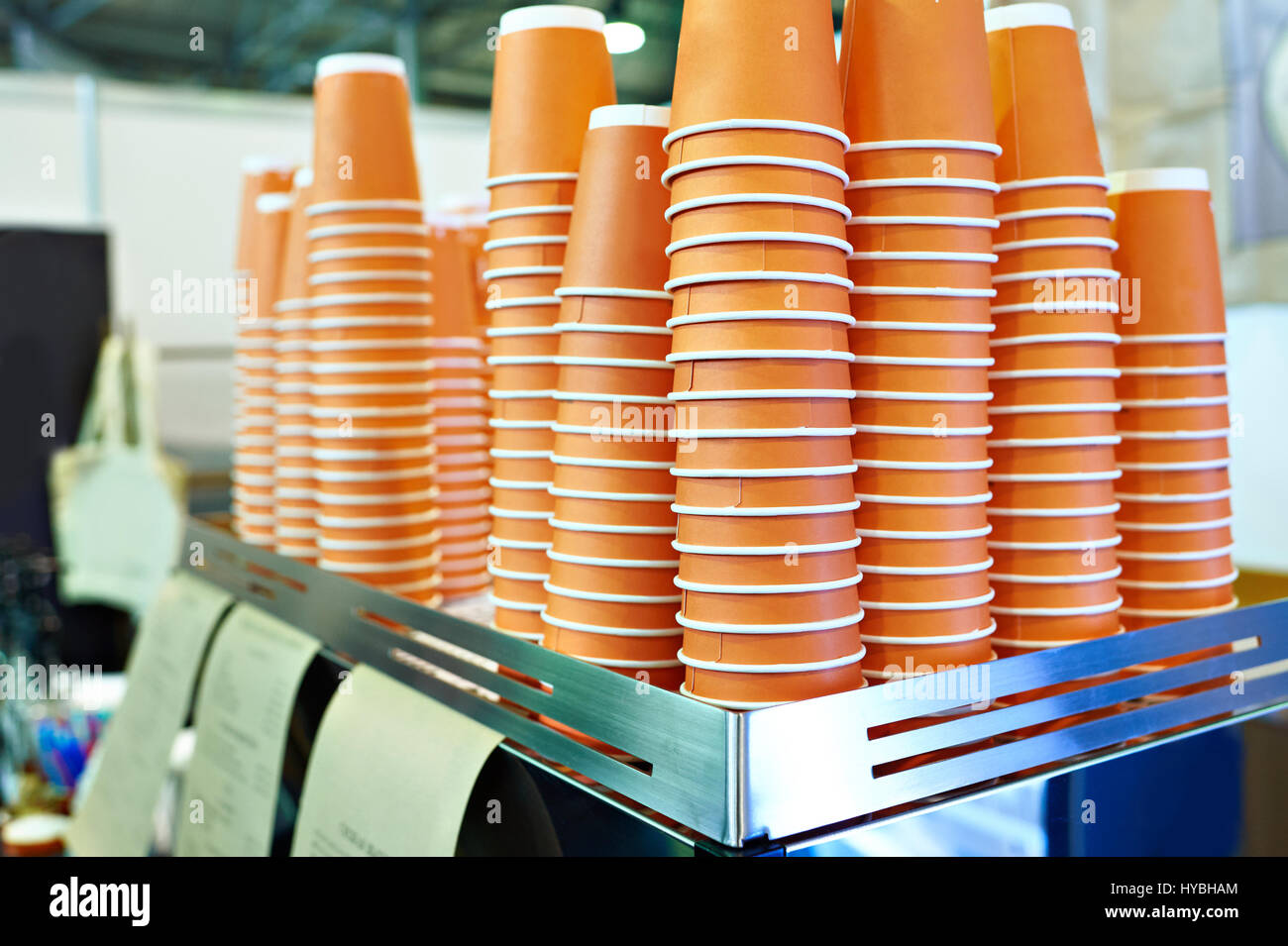 Paper orange cups for tea in a cafe Stock Photo