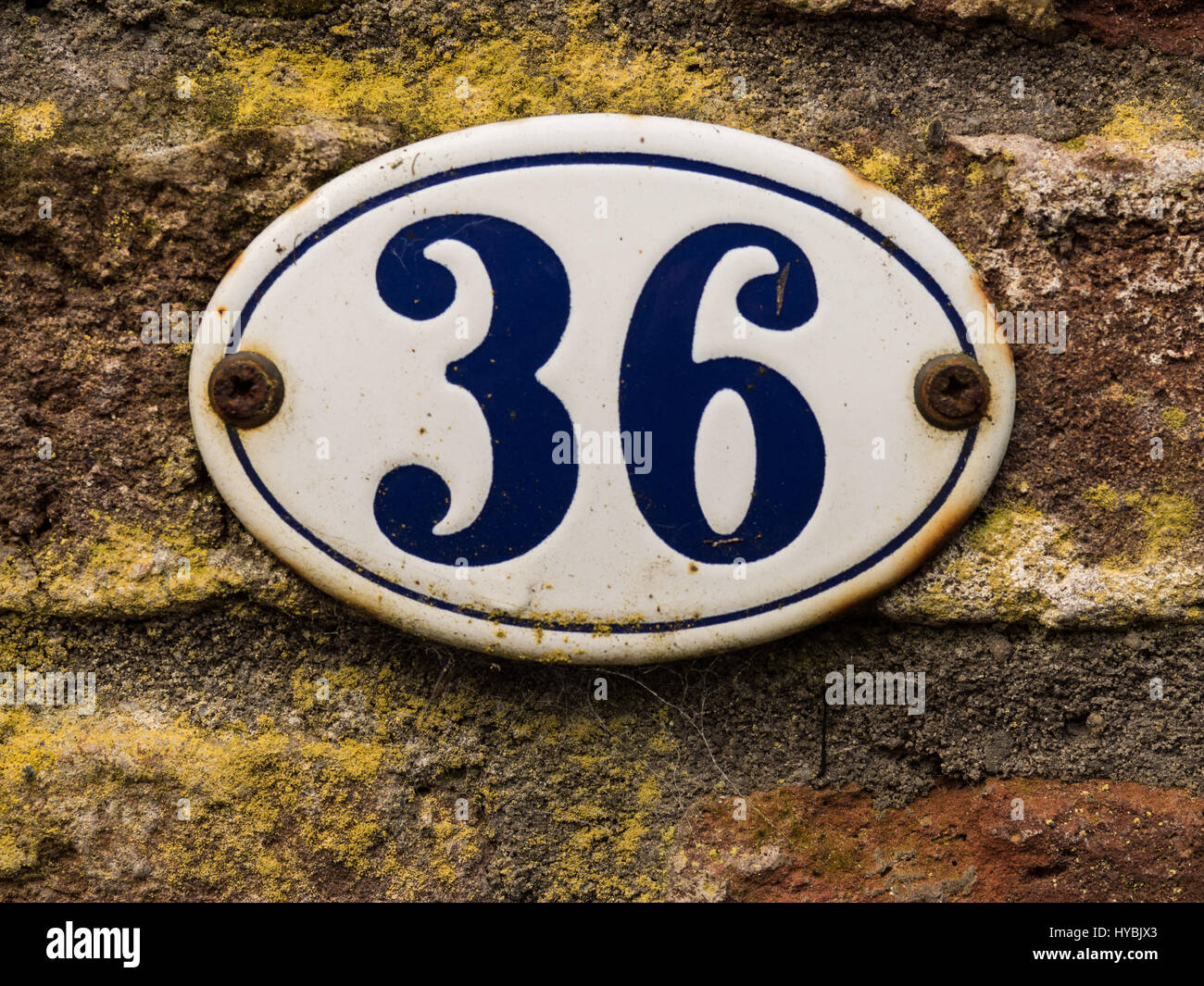 enameled old house number 36 in wihte and blue Stock Photo